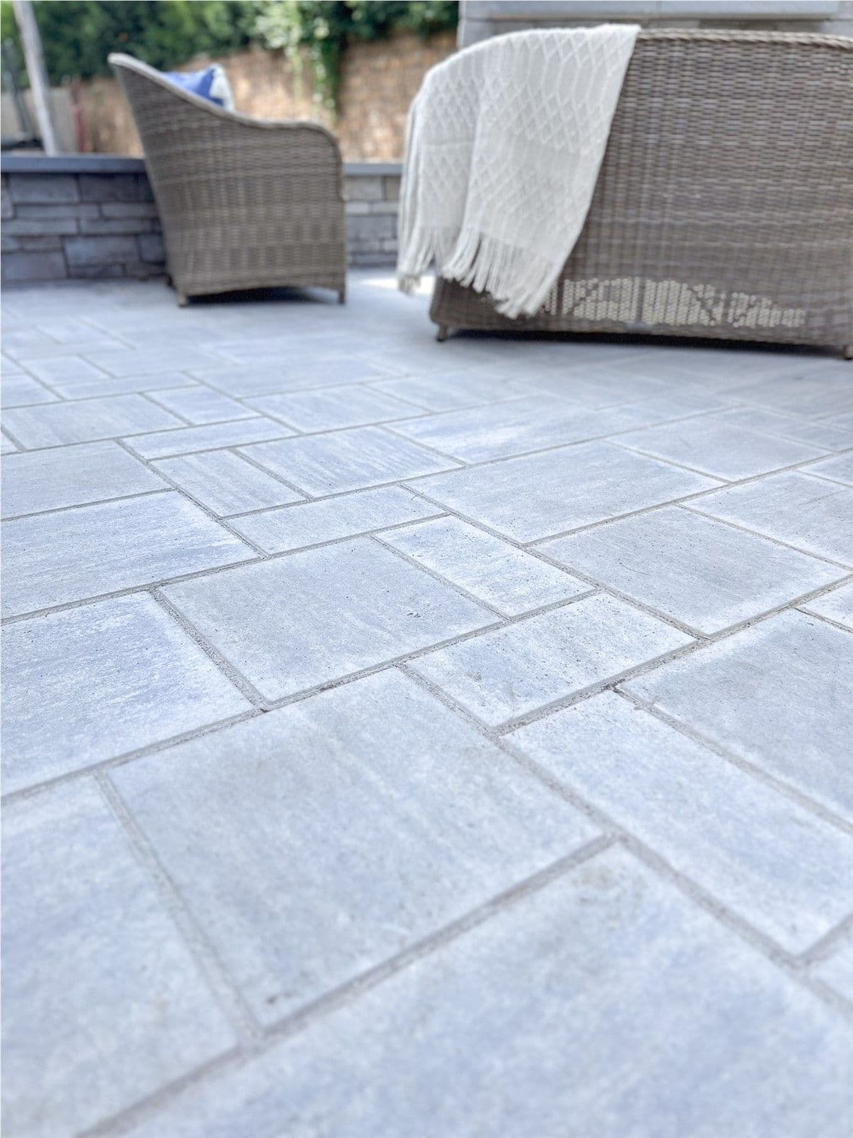 The light gray stone pavers of a patio.